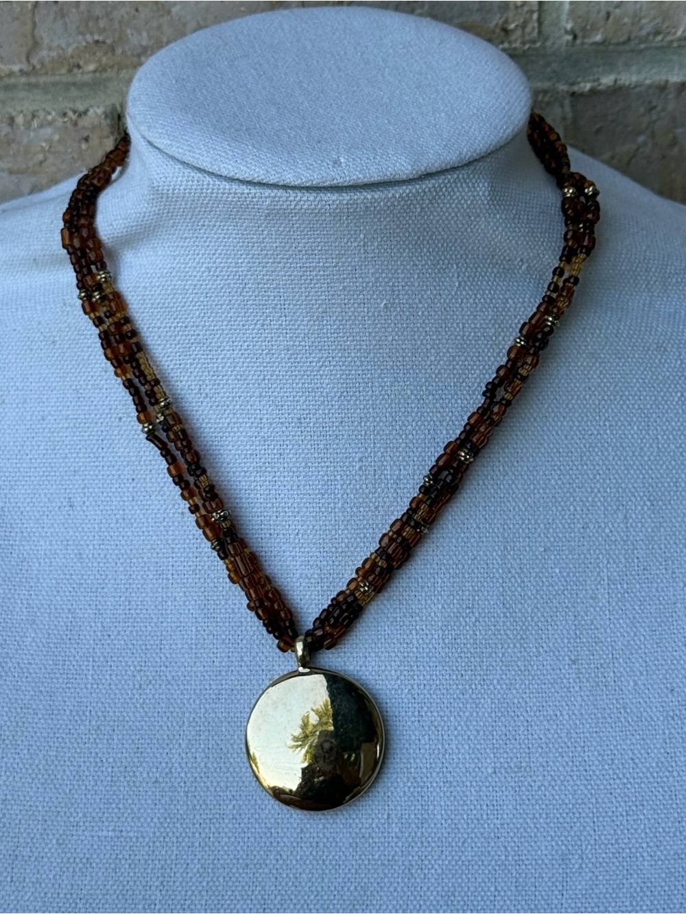 Monet Brown Multi-Strand Beaded Necklace with Gold Disc Pendant